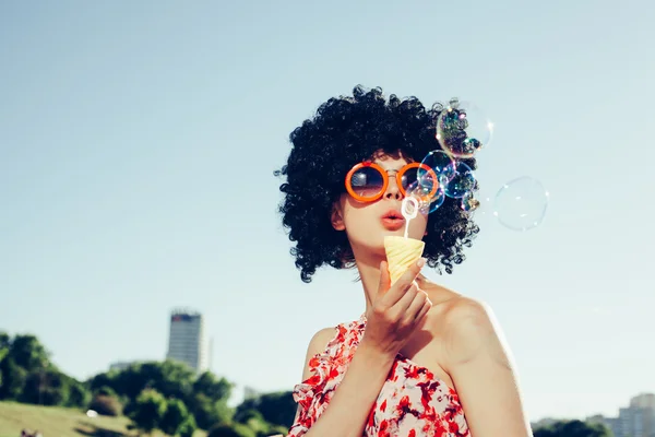 Vintage photo of soap bubble blower woman — Stock Photo, Image