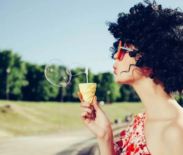 Vintage photo of soap bubble blower woman — Stock Photo, Image