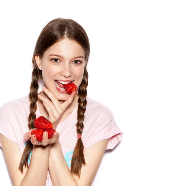 Young cute happy girl enjoy fresh strawberries — Stockfoto