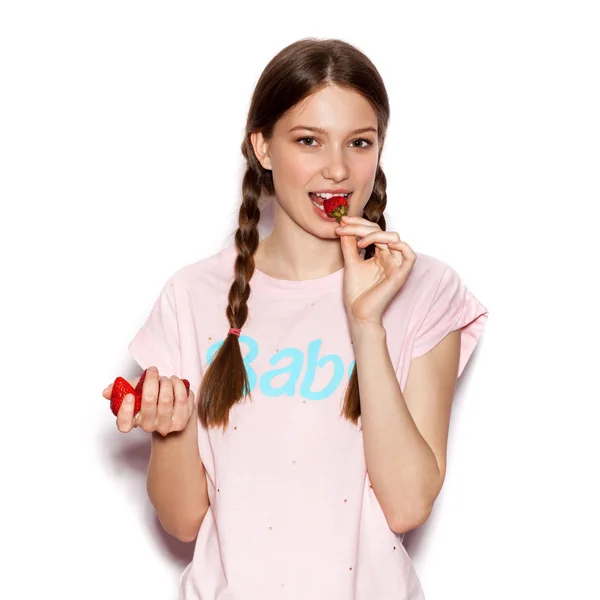 Young cute happy girl enjoy fresh strawberries — Φωτογραφία Αρχείου