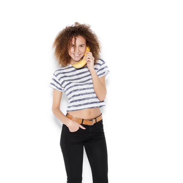 Young pretty woman making fun with banana — Stock Photo, Image