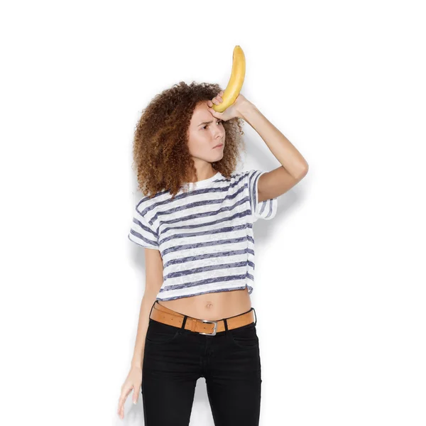 Young pretty woman making fun with banana — Stock Photo, Image
