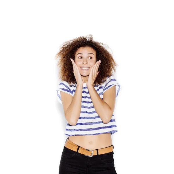 Surprised girl holding her head in amazement and open-mouthed — Stockfoto