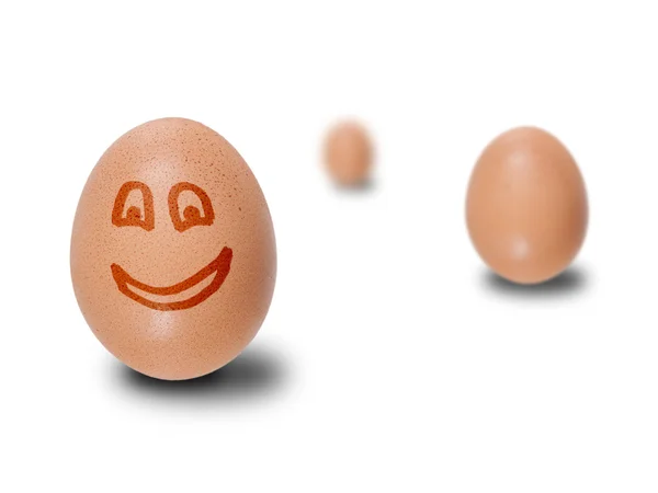 Brązowe jaja z twarzy rysowany — Zdjęcie stockowe