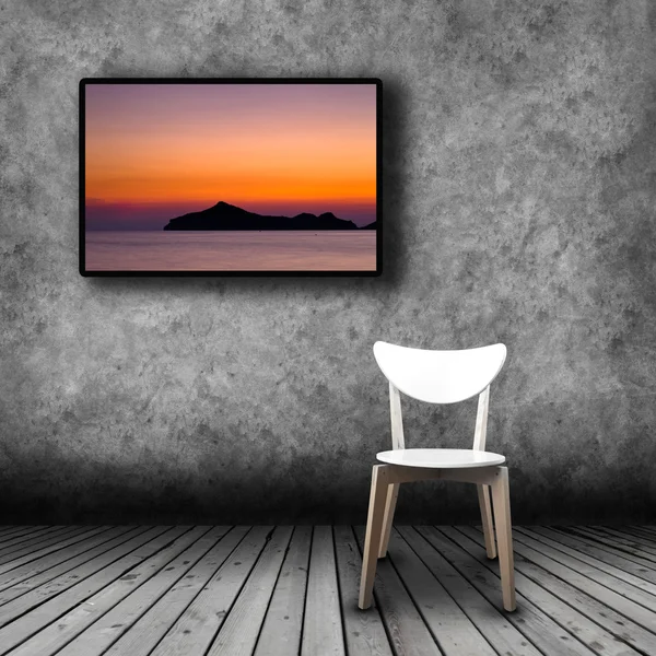 Plasma TV on the wall of the room with empty chair — Stock Photo, Image