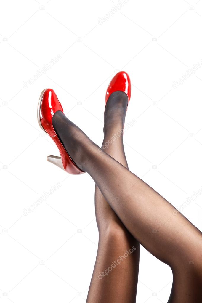 Woman's Legs Wearing Pantyhose and High Heels