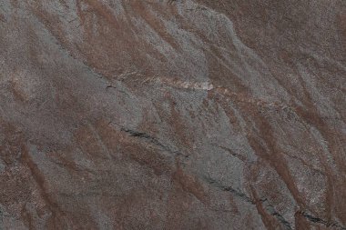 Karanlık taş ya da kaya dokusu arka planı. Yüksek çözünürlüklü duvar tasarımı