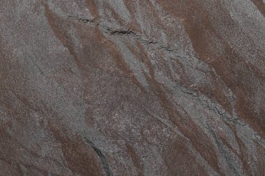 Karanlık taş ya da kaya dokusu arka planı. Yüksek çözünürlüklü duvar tasarımı