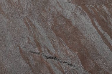 Karanlık taş ya da kaya dokusu arka planı. Yüksek çözünürlüklü duvar tasarımı