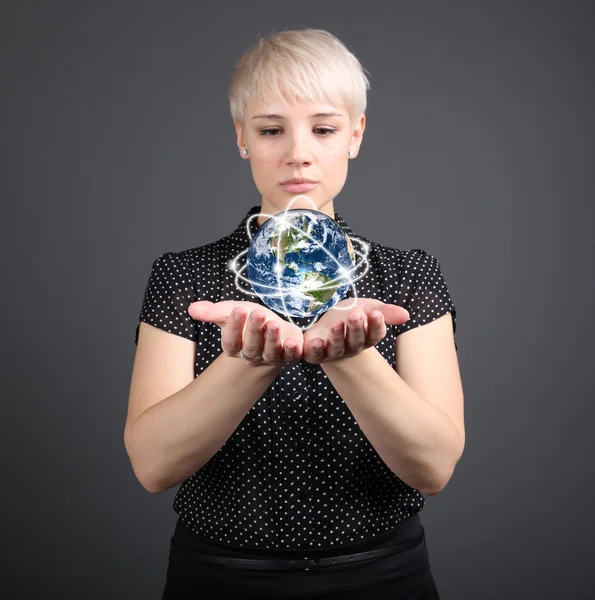 Girl holding earth — Stock Photo, Image