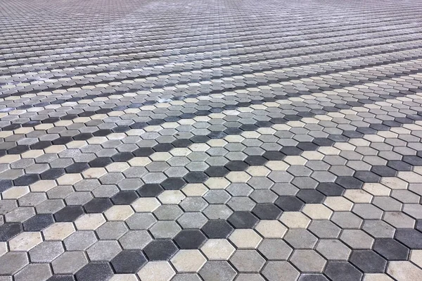 Textur der Pflasterplatten aus nächster Nähe. Betonpflasterplatten. Schönes Muster, Hintergrund Nahaufnahme. — Stockfoto