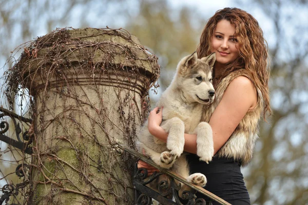 Young woman with dog — Stock Photo, Image
