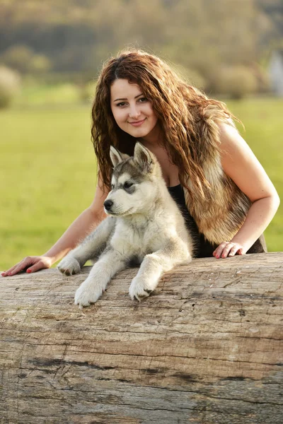 Young woman with dog — Stock Photo, Image