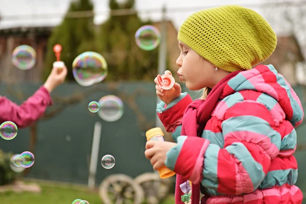 Little girl with soap bubbles — Stock Photo, Image