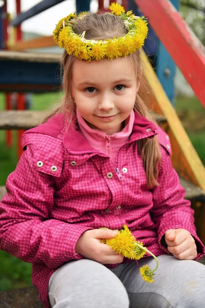 Young girl with dandelion chaplet — Stock Photo, Image