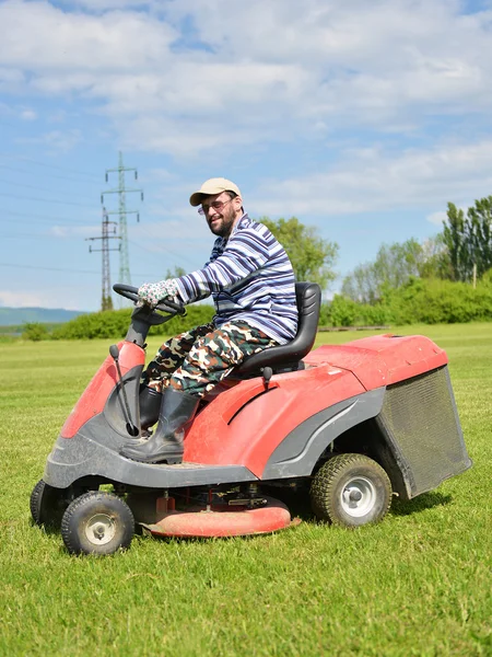 Ride-on lawn mower cutting grass. — Stock Photo, Image
