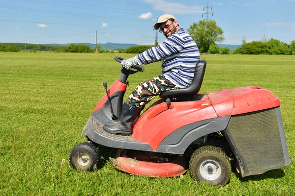 Ride-on lawn mower cutting grass. — Stock Photo, Image