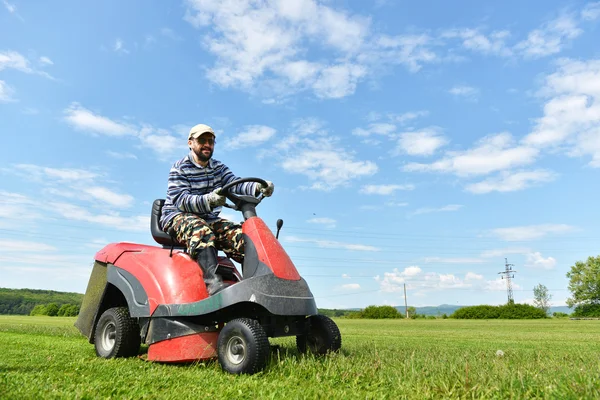 Ride-on lawn mower cutting grass. — Stock Photo, Image