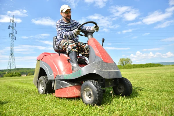 Ride-on lawn mower cutting grass. — Stock Photo, Image