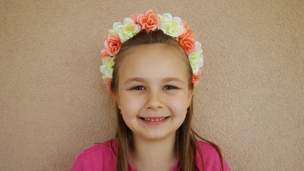 Little girl wearing floral headband — Stock Photo, Image