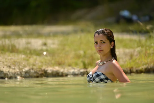 Beautiful woman posing in water — Stock Photo, Image