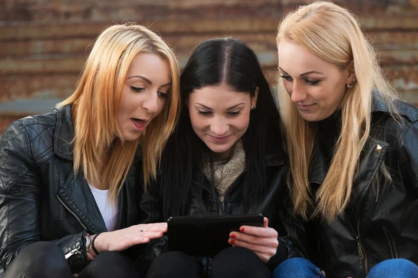 Girls looking at digital tablet Royalty Free Stock Images