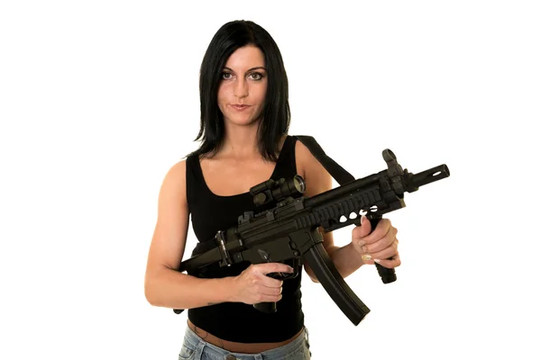 Beautiful woman with gun — Stockfoto