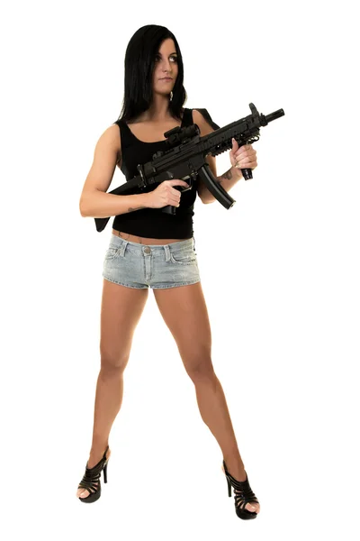 Beautiful woman with gun — Stok fotoğraf