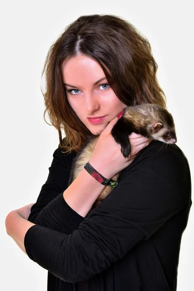 Beautiful girl holding a ferret — Stock Photo, Image