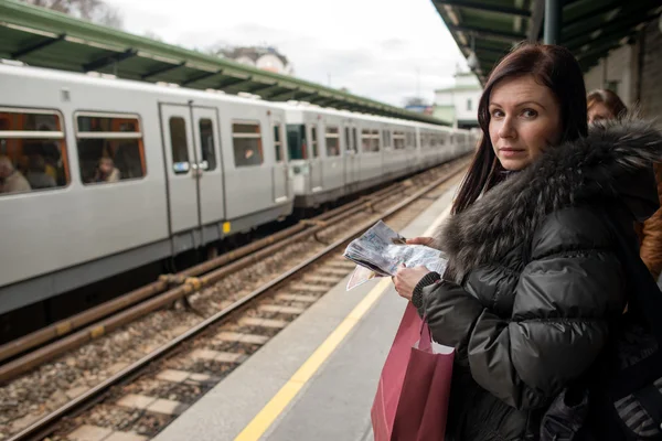 Woman travelling with metro train — Stock Photo, Image