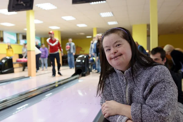 Woman with down syndrome at bowling — Stock Photo, Image