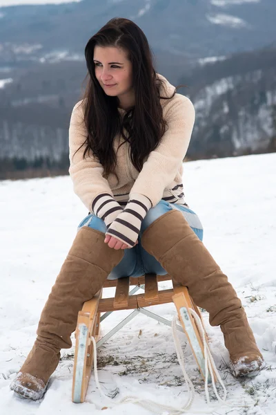 Happy girl with sledge — Stock Photo, Image