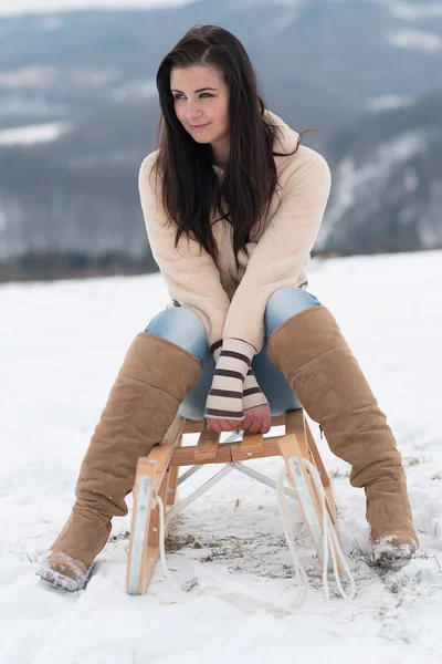 Happy girl with sledge — Stock Photo, Image