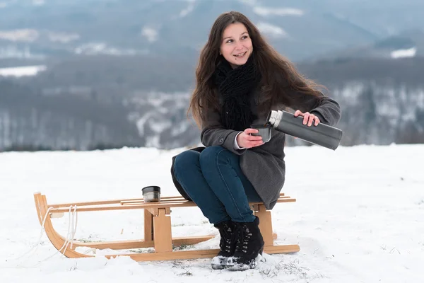 Girl drinking hot tea in the winter — Stock Photo, Image