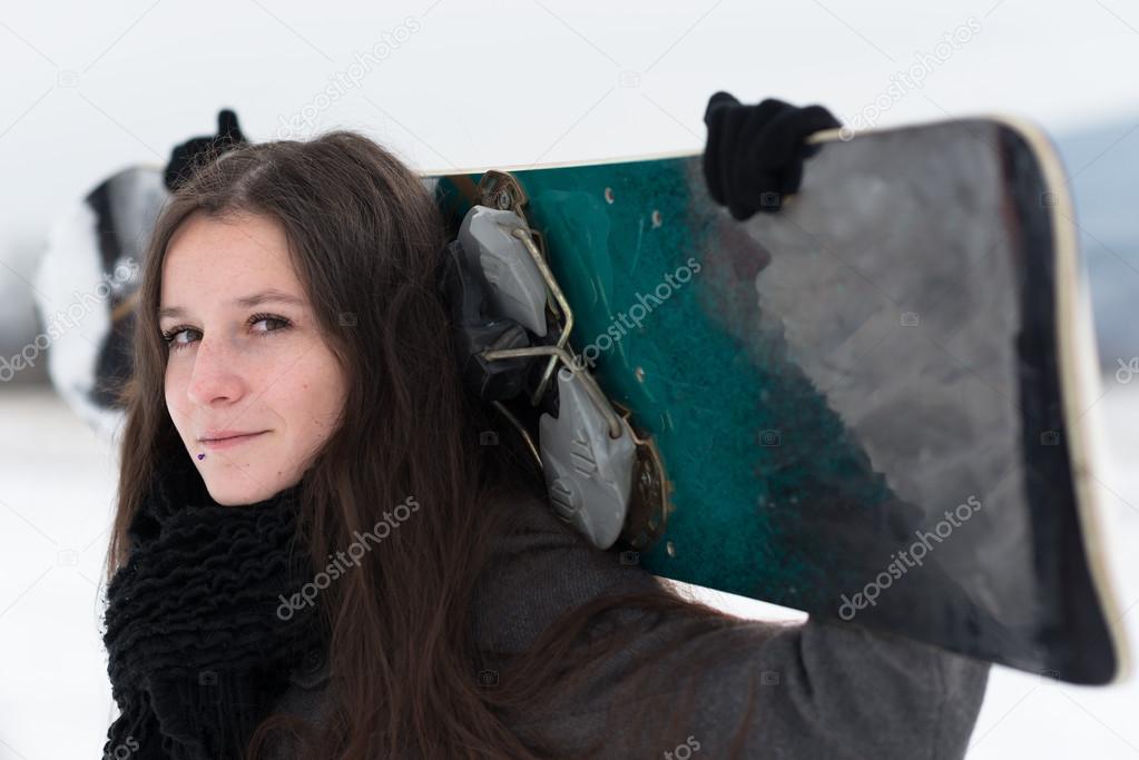 Young girl with snowboard