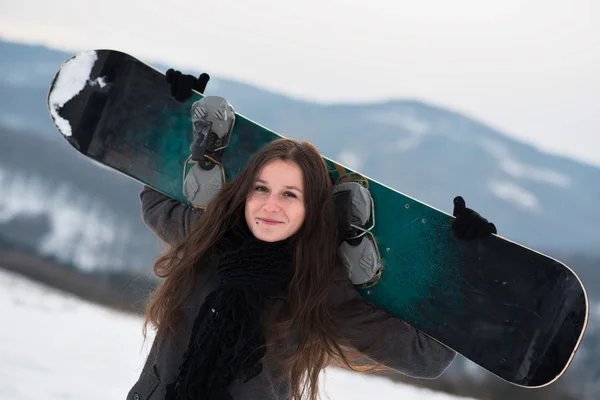 Young girl with snowboard — Stock Photo, Image