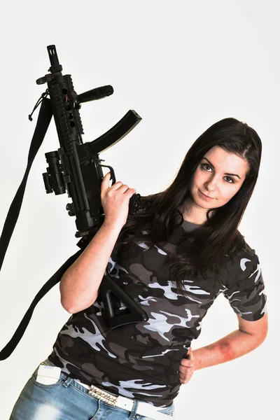 Beautiful woman with gun — Stok fotoğraf