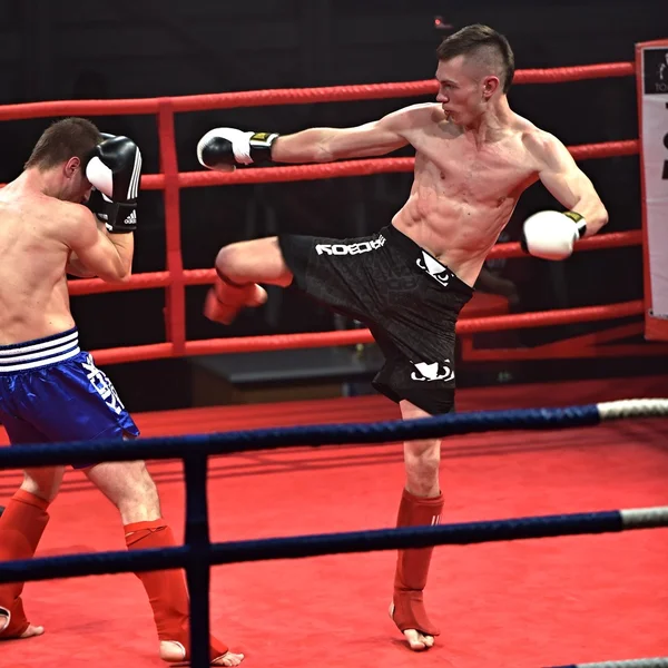 Strong fighter and his opponent during a fight in a ring Combat Fight Night — Stock Photo, Image