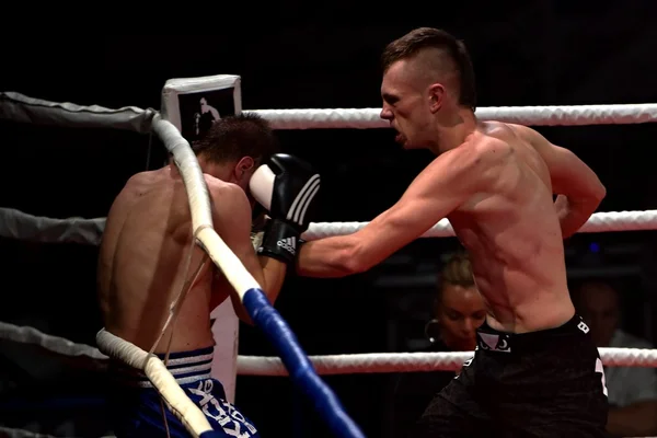 Strong fighter and his opponent during a fight in a ring Combat Fight Night — Stock Photo, Image