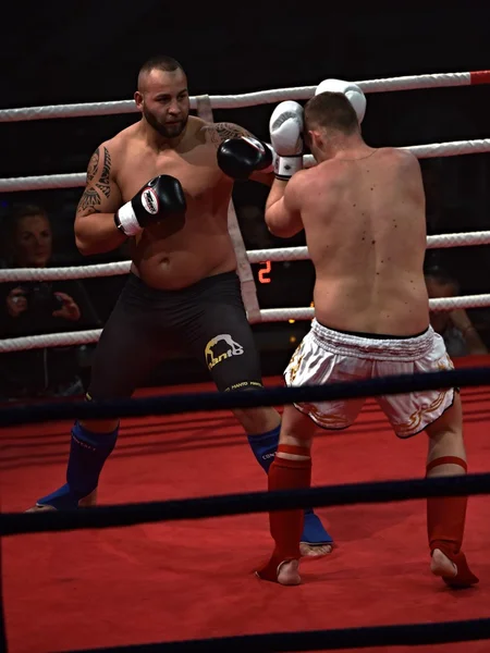 Strong fighter and his opponent during a fight in a ring Combat Fight Night — Stock Photo, Image