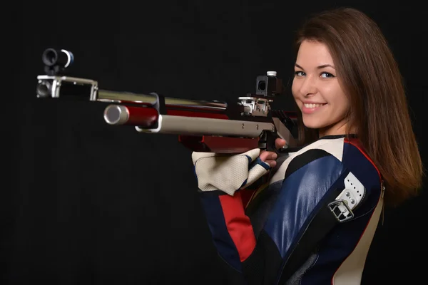 Mujer entrenamiento deporte tiro con pistola de aire comprimido — Foto de Stock