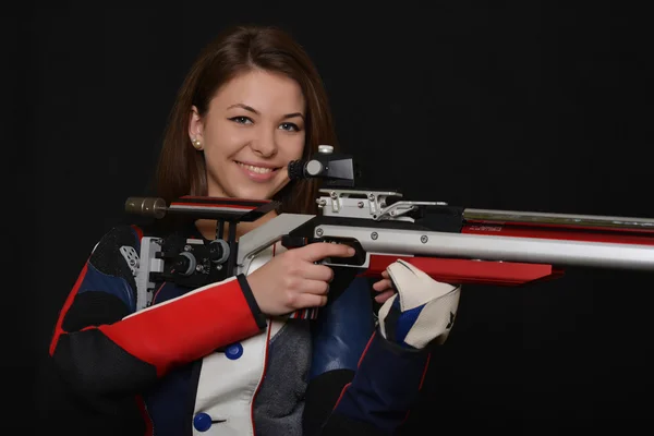 Mujer entrenamiento deporte tiro con pistola de aire comprimido — Foto de Stock