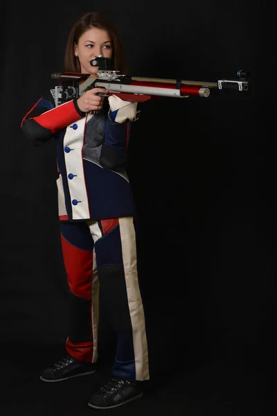 Mujer entrenamiento deporte tiro con pistola de aire comprimido — Foto de Stock