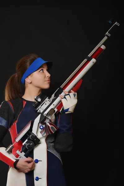 Mujer entrenamiento deporte tiro con pistola de aire comprimido — Foto de Stock