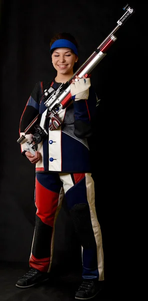 Mujer entrenamiento deporte tiro con pistola de aire comprimido — Foto de Stock