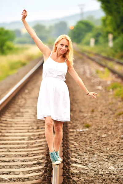 Pregnant woman on rails — Stock Photo, Image