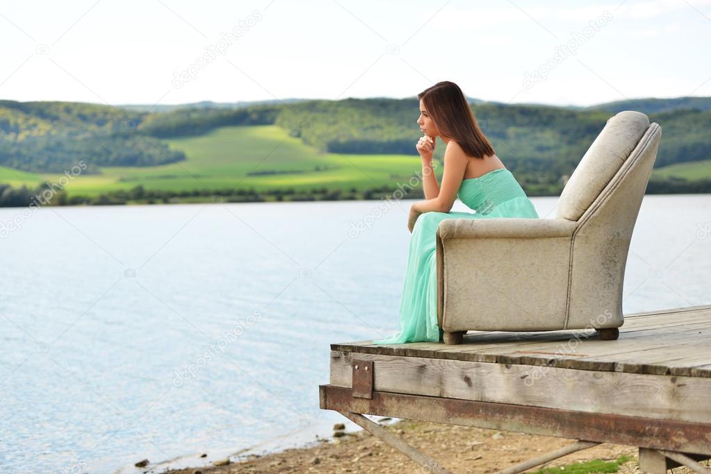 Girl in sofa outdoors