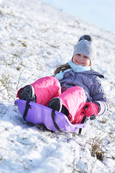 Little girl on sleigh — Stock Photo, Image