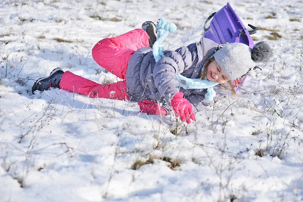 Little girl on sleigh — Stock Photo, Image