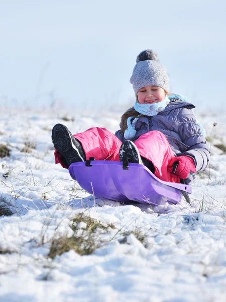 Little girl on sleigh — Stock Photo, Image